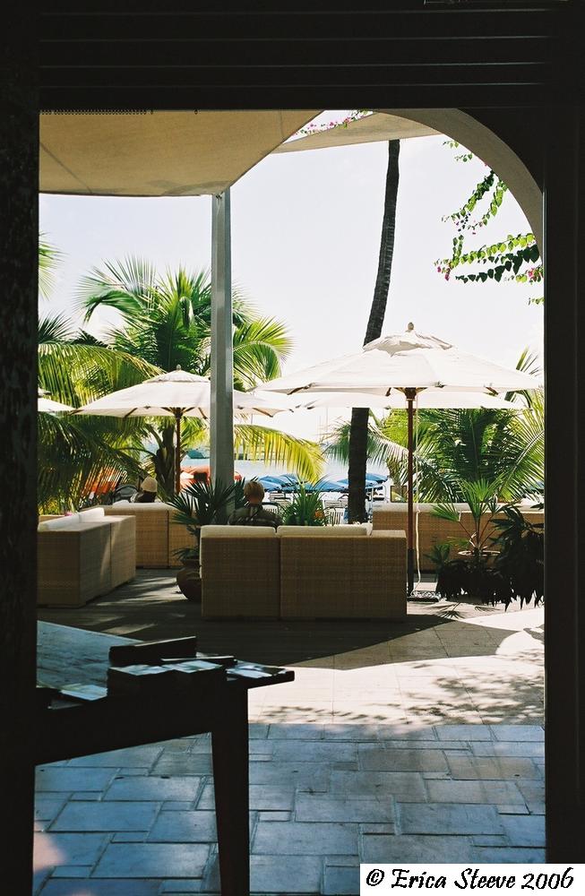A hotel's open lobby and beach
