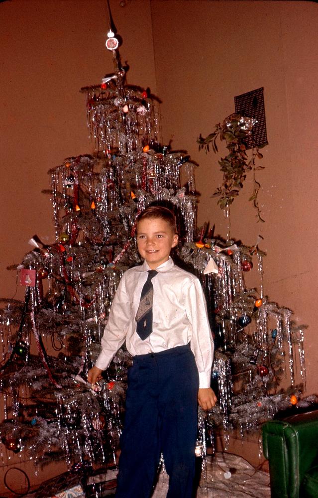 1960, 12: Doug in front of the Xmas tree