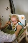 1975, 08,07: baby in high chair