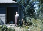 1958, woman at cabin?
