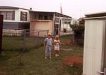 1971: Boy and girl in yard
