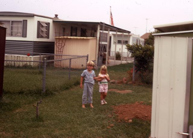 1971: Boy and girl in yard