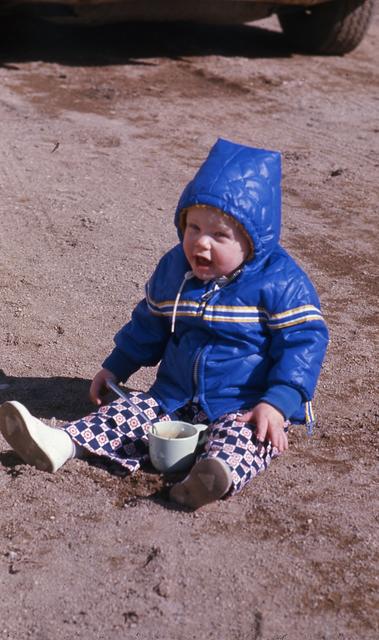 1976, 06:  Eddy playing in sand