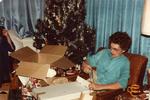 Mom opening gifts at Christmas