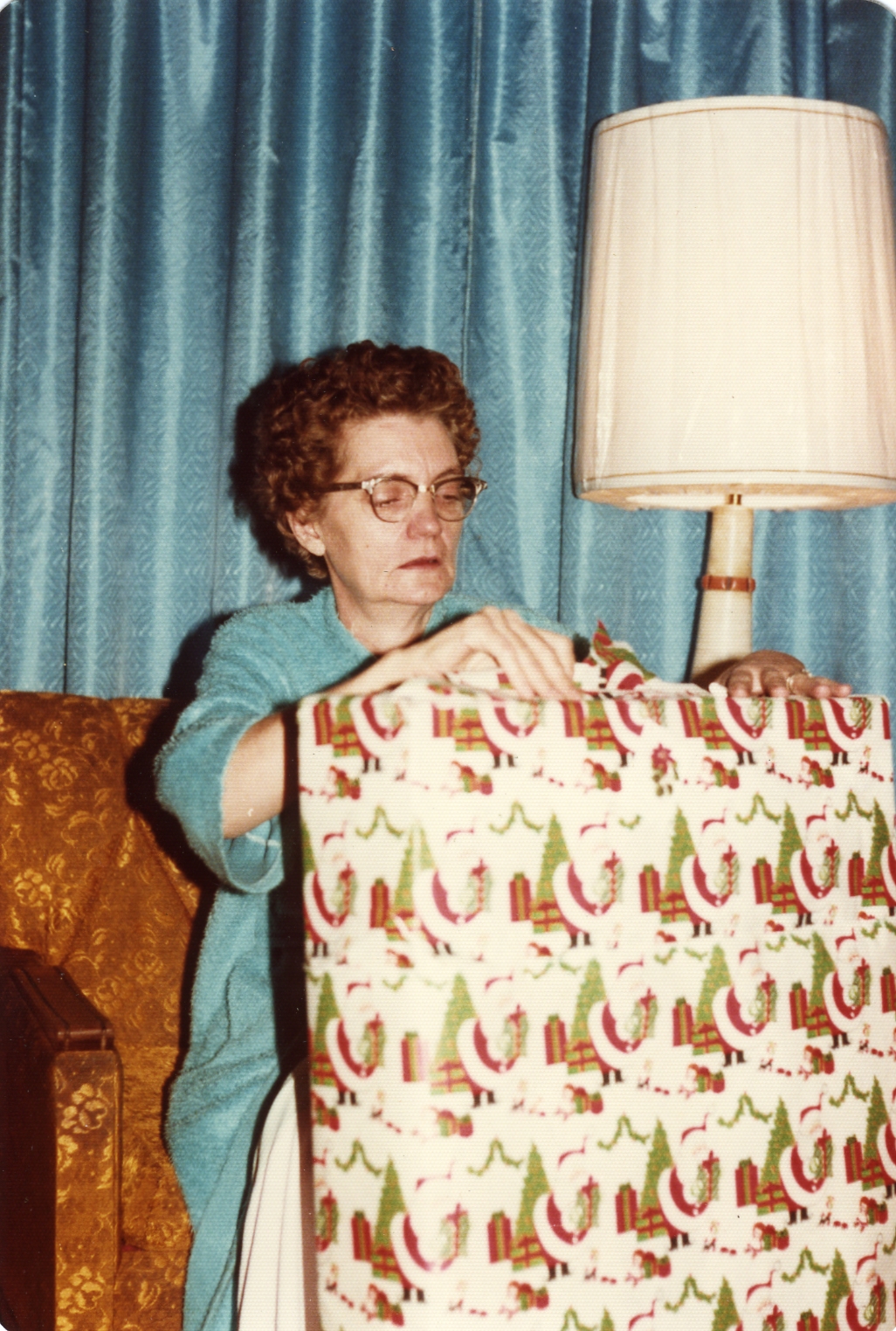 Mom opening gifts at Christmas