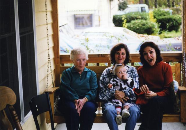 Grandma, Jill, Sue, and a little cow