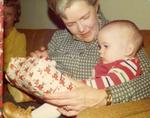 Grandma holding baby at Chrismas